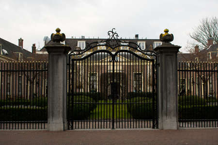 A nice botanical garden in Haarlem Holland with a gate in front of it.