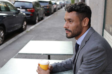 Elegant businessman during coffee break