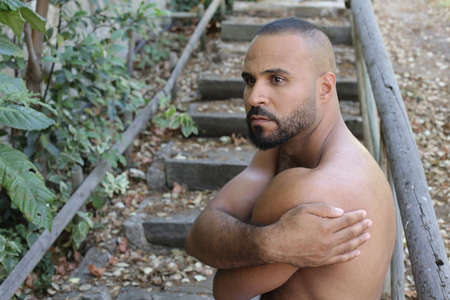 Shirtless man expressing self loveの写真素材