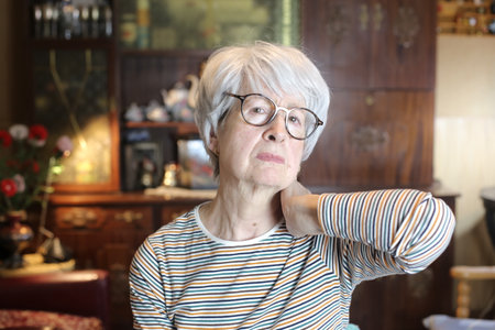 Senior woman suffering neck pain