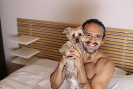 Man and dog sharing good timesの写真素材
