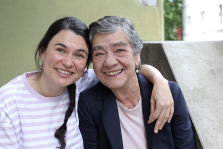 Mother and daughter smiling togetherの写真素材
