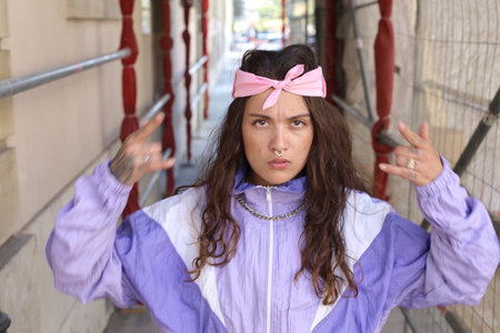 Female rapper doing hand gesturesの写真素材