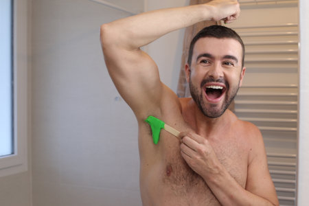 Handsome wan waxing his armpitの写真素材