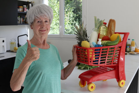 Senior woman giving a thumbs upの写真素材