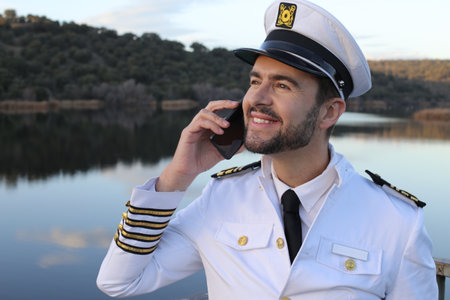 Ship captain making an international callの写真素材