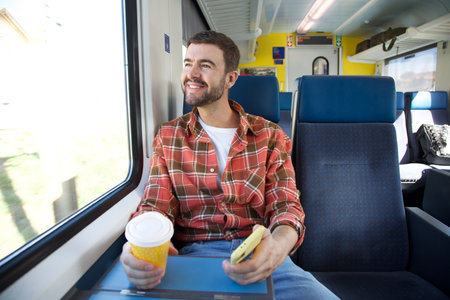 Traveler enjoying a confortable trainの写真素材
