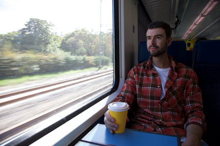 Traveler enjoying a confortable trainの写真素材