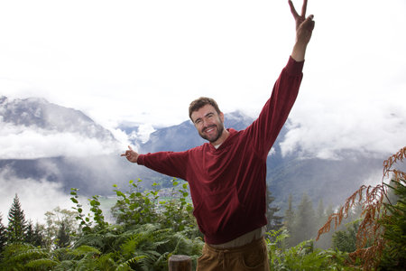 Man achieving the end of a hike and celebratingの写真素材