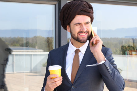 Man with a turban using a cellphoneの写真素材