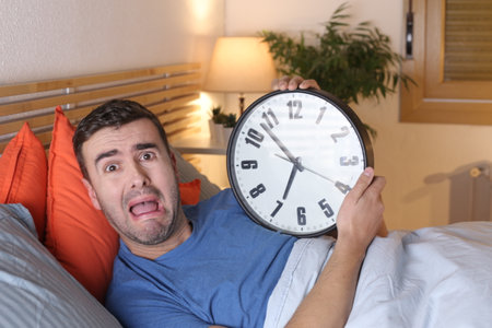 Hectic man obsessed about time passingの写真素材