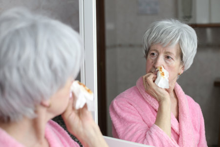 Woman with a major nose bleedの写真素材