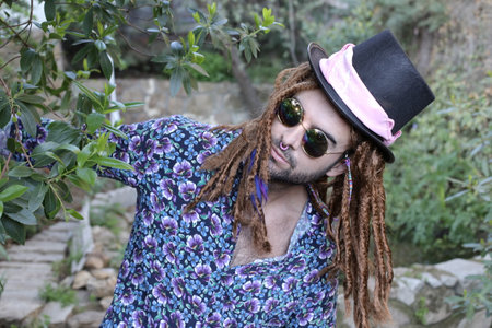 Extravagant man with dreadlocks hairstyle and septum nose ringの写真素材