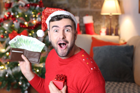 Man making tons of money during Christmas timeの写真素材