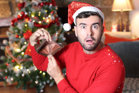 Man overspending his money during Christmas timeの写真素材