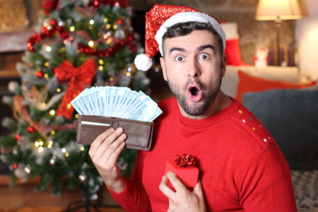 Man making tons of money during Christmas timeの写真素材