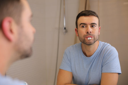 Comedic man playing with rabbit teethの写真素材
