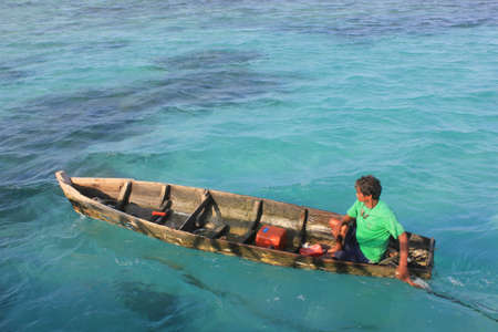 Jakarta, April 1, 2012 - Indonesian fishermen were rowing boat at sea, Tidung Island.のeditorial素材