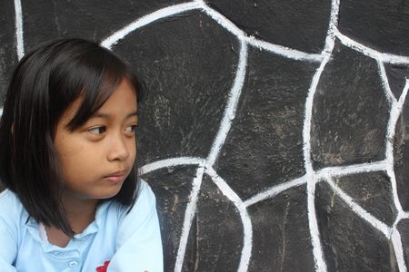 Little girl staring into the distance 