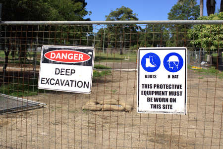 Work place safety sign boards at construction site 'Boots Hat This protective equipment must be worn...