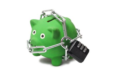 Macro of green piggy bank with padlock and chainsの写真素材