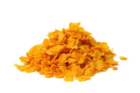 Heap of corn flakes isolated on white background.