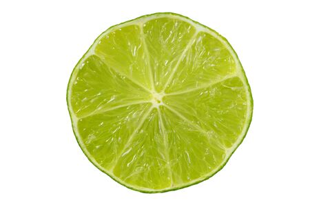 Macro of lime slice isolated on white background.