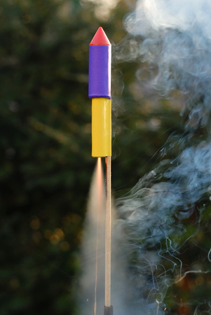 Launching rocket with fire and plenty of smoke
