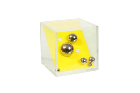 Balls and holes puzzle isolated on white backgroundの写真素材