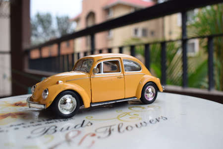Vintage Yellow car toy outdoor background. High-quality photoの写真素材