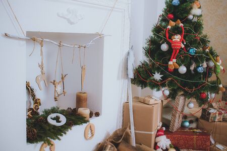 New interior with Christmas tree, presents and fireplaceの写真素材