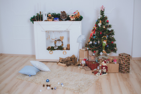 New interior with Christmas tree, presents and fireplaceの写真素材