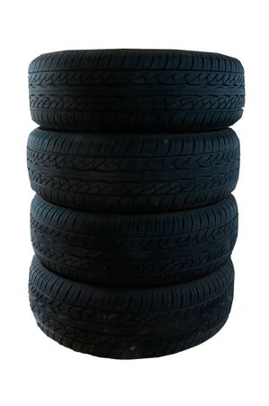 tires stacked up and isolated on white backgroundの写真素材