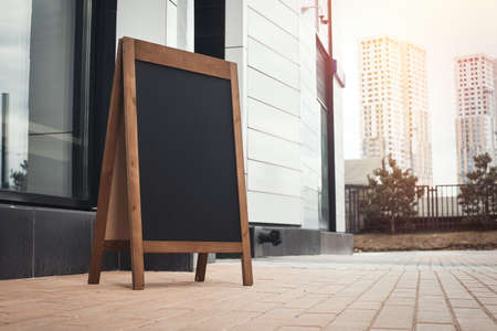Sandwich Board at the street near skyscarpers.の写真素材