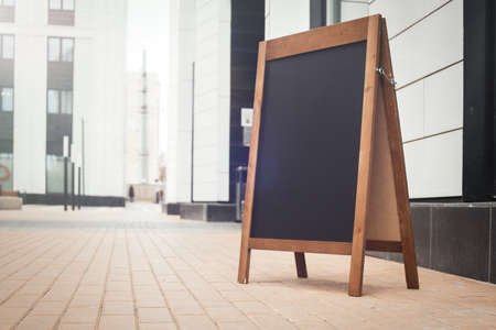 Sandwich Board at the street near skyscarpers.の写真素材