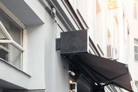 Blank store signboard. Empty shop street sign template mounted on the wall.