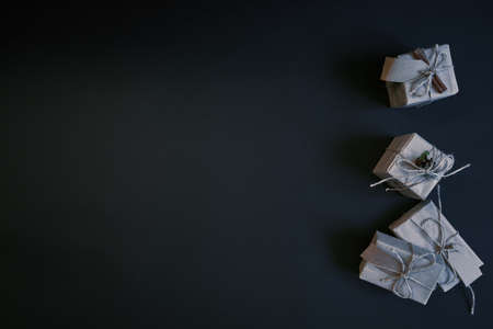 Flat lay of gift boxes on dark background. New year celebration concept.の写真素材