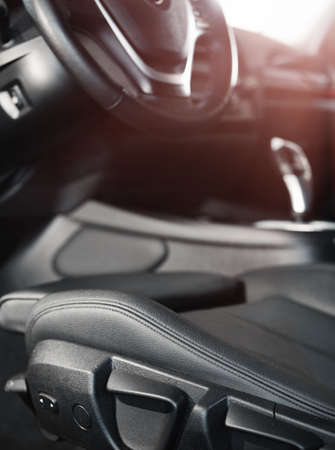 Dark luxury car Interior.steering wheel, shift lever and dashboard. Car interior luxury. Black panels.の写真素材