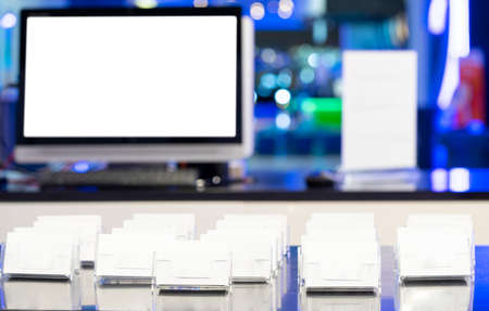 Blank monitors and business cards at the entrance in gym. Futuristic reception.の写真素材