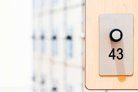 Lockers with electronic locks and fingerprint scanners in modern bright gym.