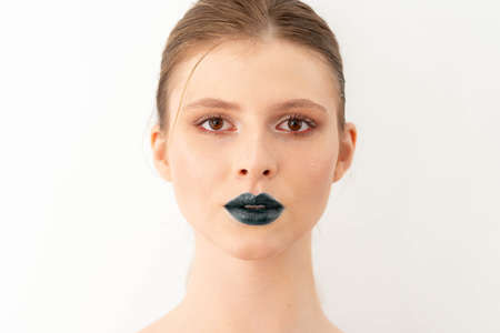 Young beautiful woman with finished make up. High fashion. Tutorial. Bloggerの写真素材