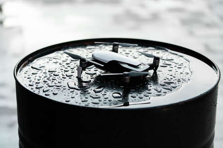 Close up of drone quadcopter on black wet backround. remote controlled wireless quadcopter drone with video and photo camera for aerial photographyの写真素材