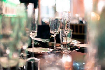 Luxury catering and service. Wedding or anniversary. Banquet. table served with cutlery, flowers, crockery and tablecloth.の写真素材