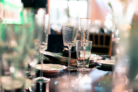 Luxury catering and service. Wedding or anniversary. Banquet. table served with cutlery, flowers, crockery and tablecloth.の写真素材