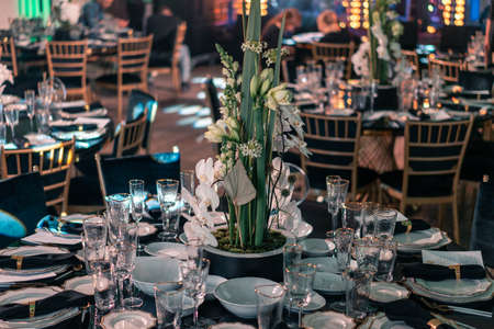 Luxury catering and service. Wedding or anniversary. Banquet. table served with cutlery, flowers, crockery and tablecloth.の写真素材
