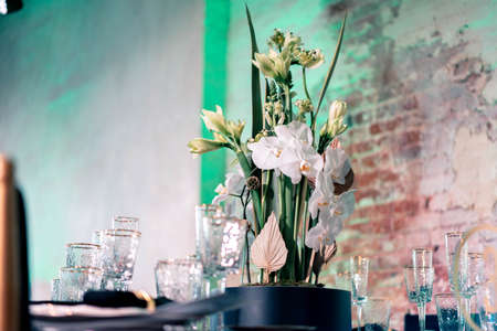 Luxury catering and service. Wedding or anniversary. Banquet. table served with cutlery, flowers, crockery and tablecloth.の写真素材
