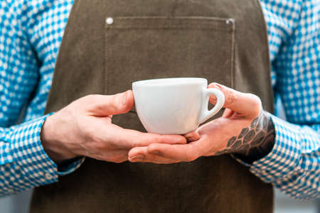 Man Barista Holding Fresh Dark Coffee. Perfect Breakfast. Stay Home Concept. Preparing Coffee At Home.の写真素材