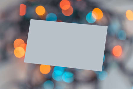 Blank White Business Card On Christmas Garland Light Background. Festive Mood And Vibes. Stationary...