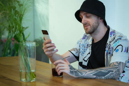 Creative Designer Holding Mobile Phone And Talking Via Video Call, Online Meeting and Conference