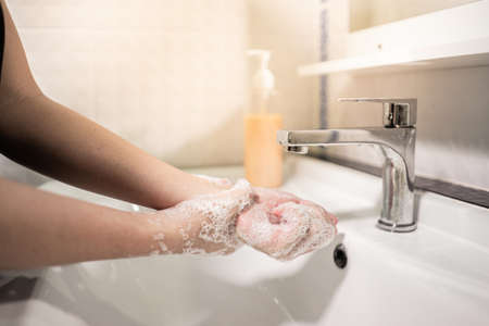 Washing hands rubbing with soap for virus prevention, hygiene to stop spreading the virus.の写真素材